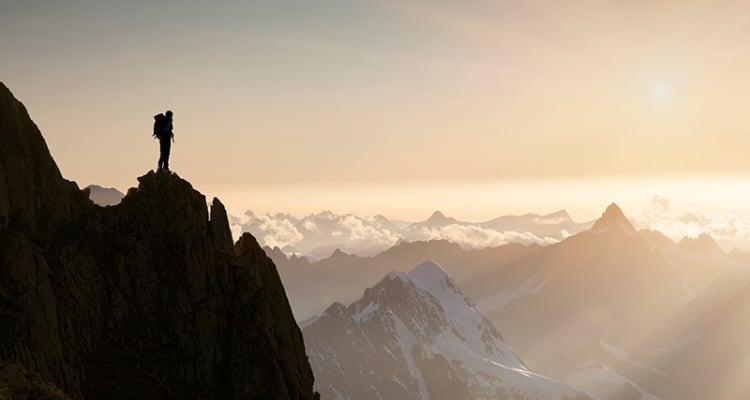 Man standing on a mountain peak