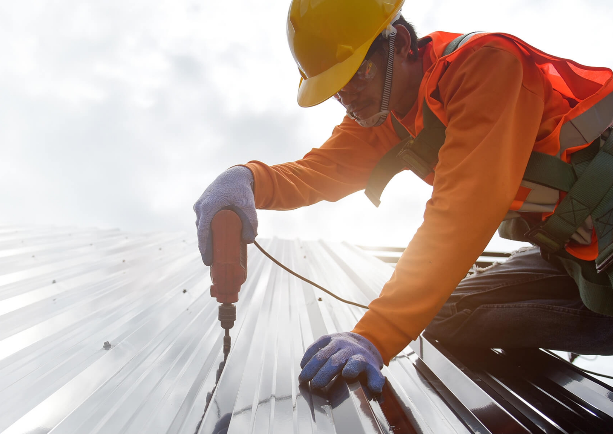 Builder working on top of a roof