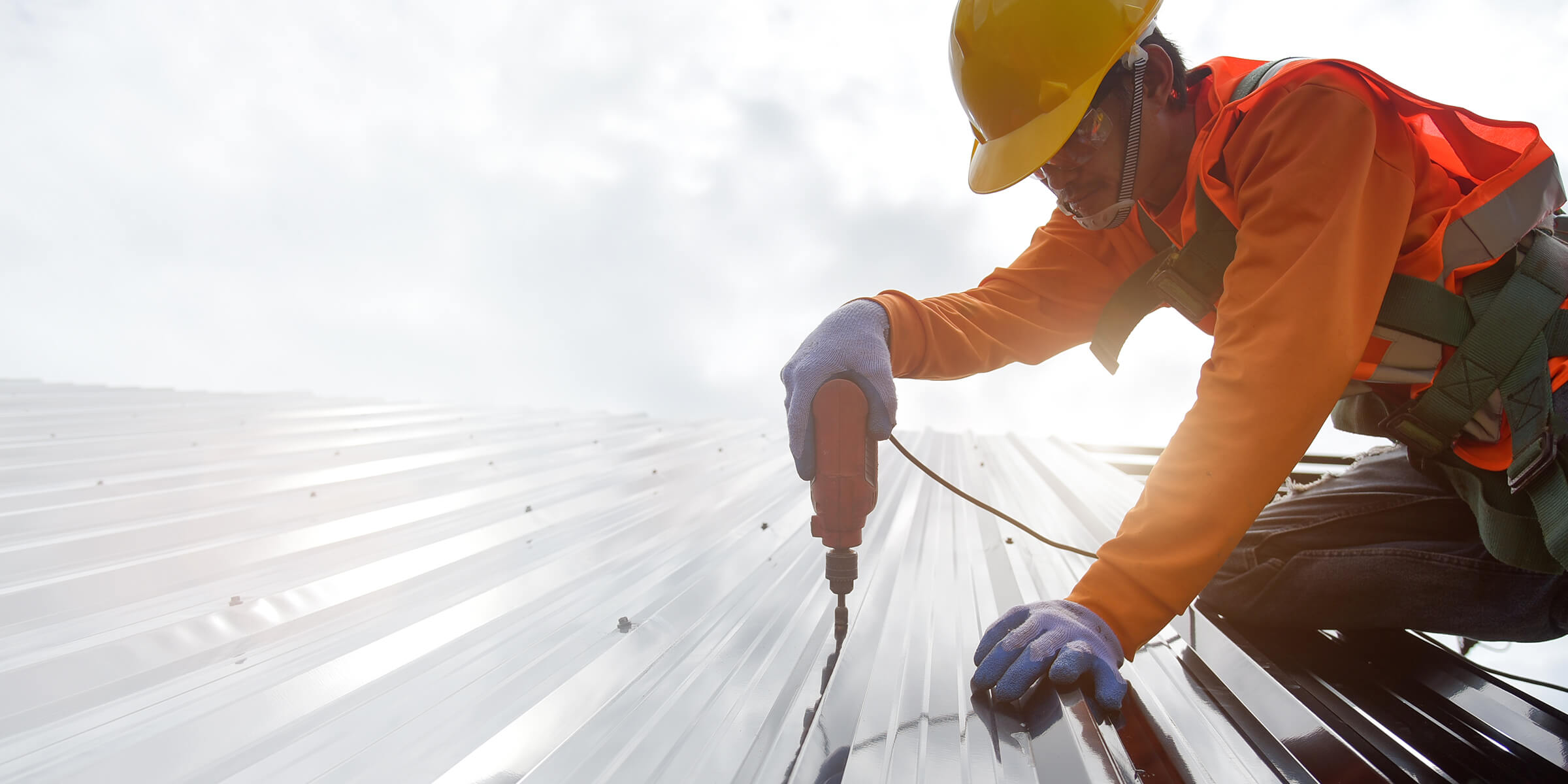 Builder working on top of a roof