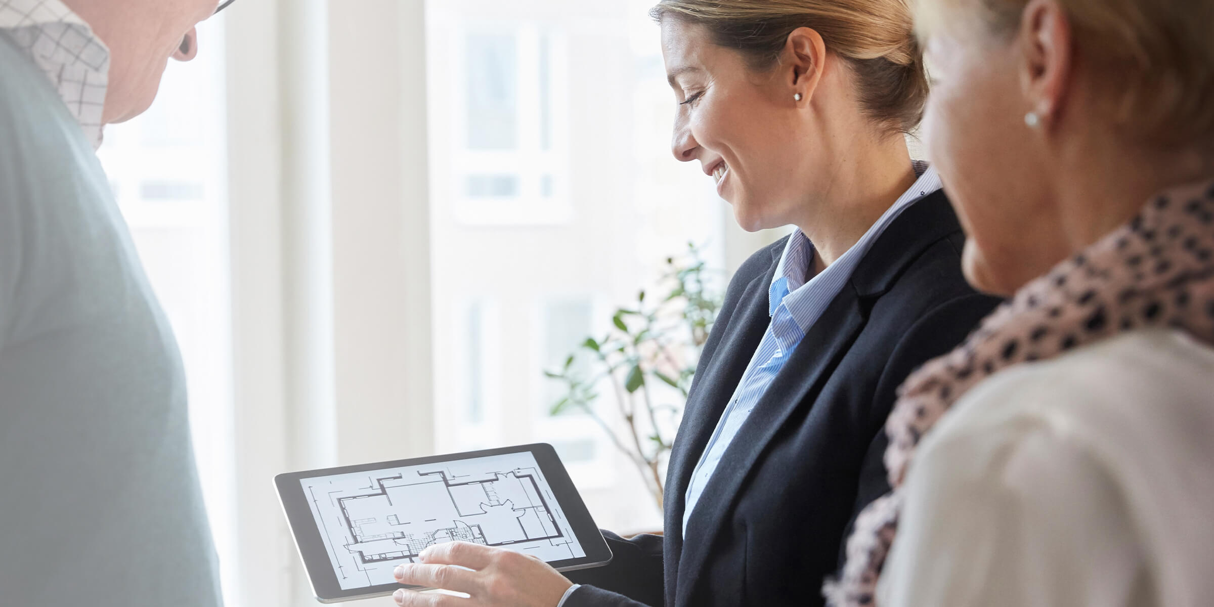 Two woman looking at a floorplan on a Ipad