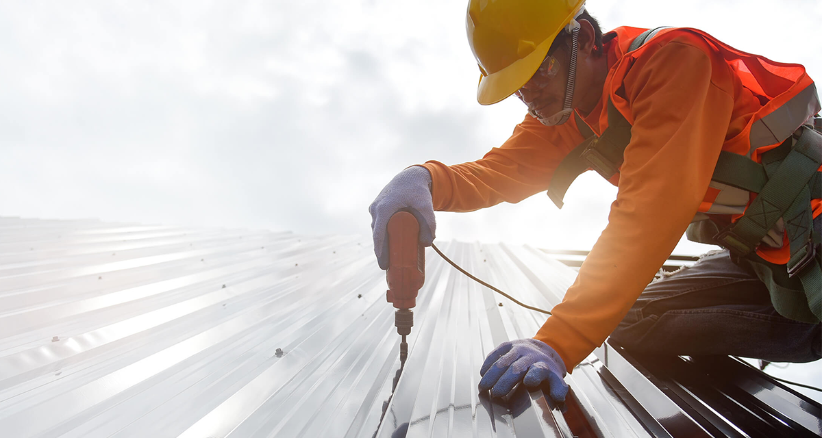 Builder working on a roof top