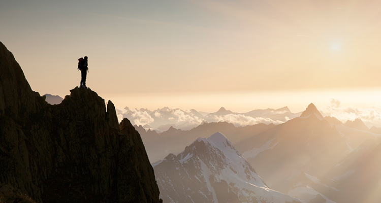 Man standing on a mountain peak